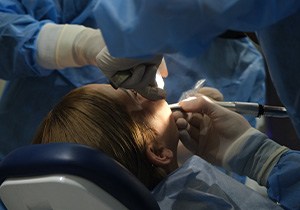 Dentist performing surgery