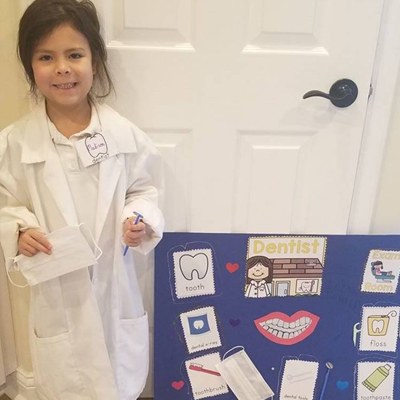 A young patient dressed as a dentist.
