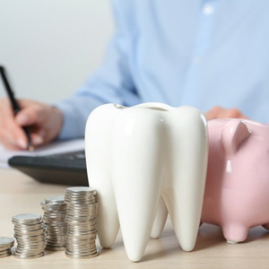 A patient calculating the cost of their dental treatment