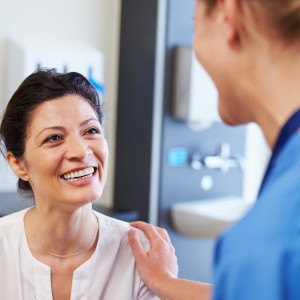 Invisalign patient at Parker Dental & Orthodontics talking to dentist