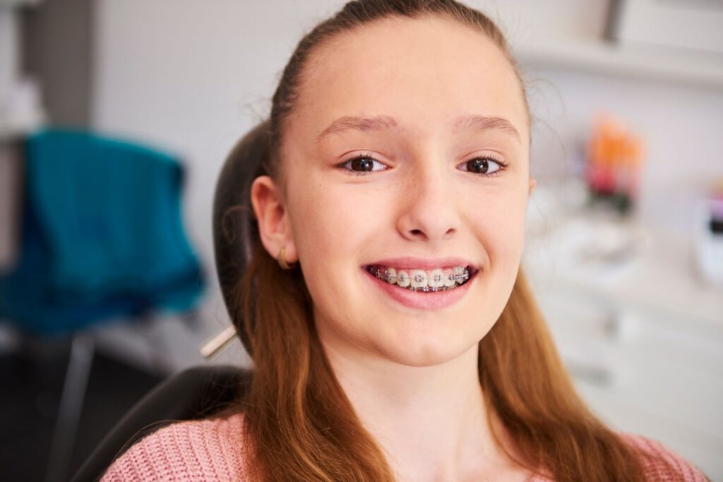 A young girl wearing braces